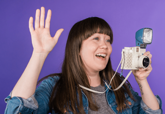 layout by flywheel best stock photo sites 2018 woman on purple background with film flash camera and hands in the air