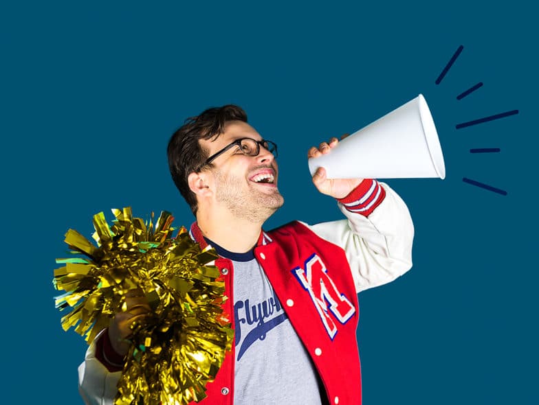 How to create a resources page: man smiles and holds a pom pom and a megaphone