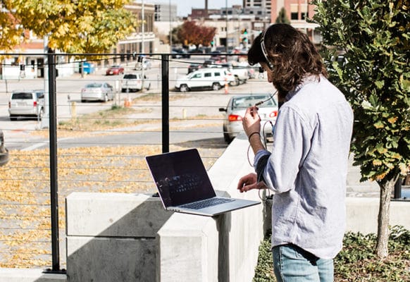 flywheel outdoors on phone talking about essential wordpress plugins marketers love