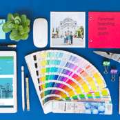 how to create a consistent brand across marketing channels example layout with branding and office supplies with flywheel branding website and instagram @heyflywheel on technology