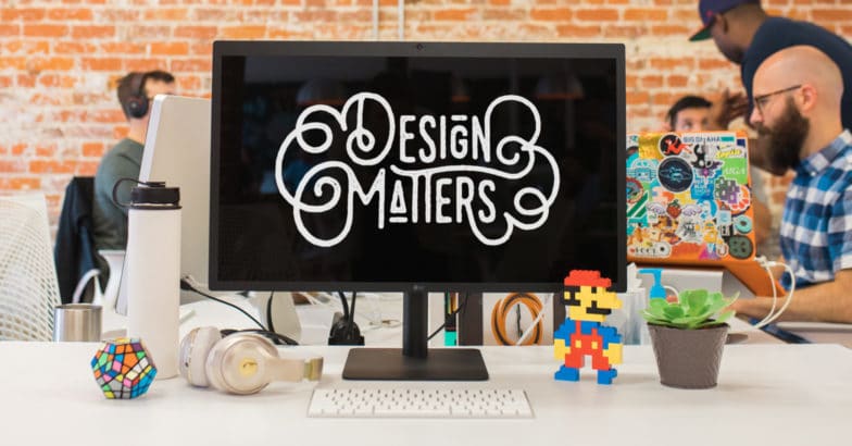 Desktop with background image which reads: Design Matters