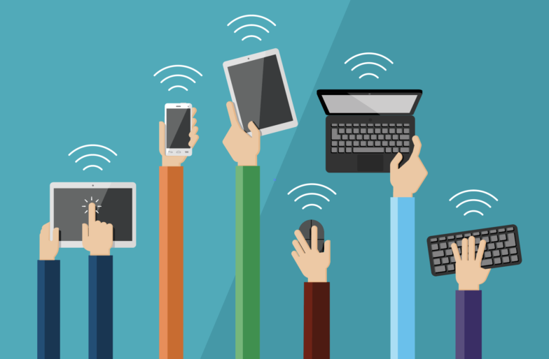 Image of 7 hands holding different mobile devices such as phones, laptops, and tablets. 