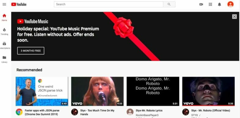 A screenshot of YouTube's colorful homepage. There's a wide hero image/video at the top. 