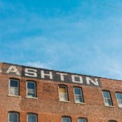 The brick exterior of the Ashton building. The word 