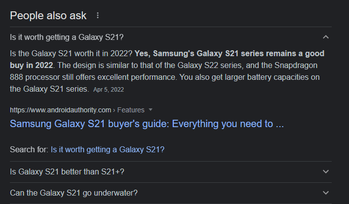 An expanded view of the first question under People Also Ask, showing an answer to the question Is it worth getting a Galaxy S21?