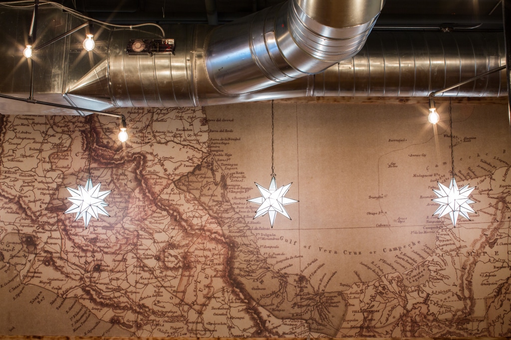Using a historic map, Oxide created a custom mural for Mula. 
