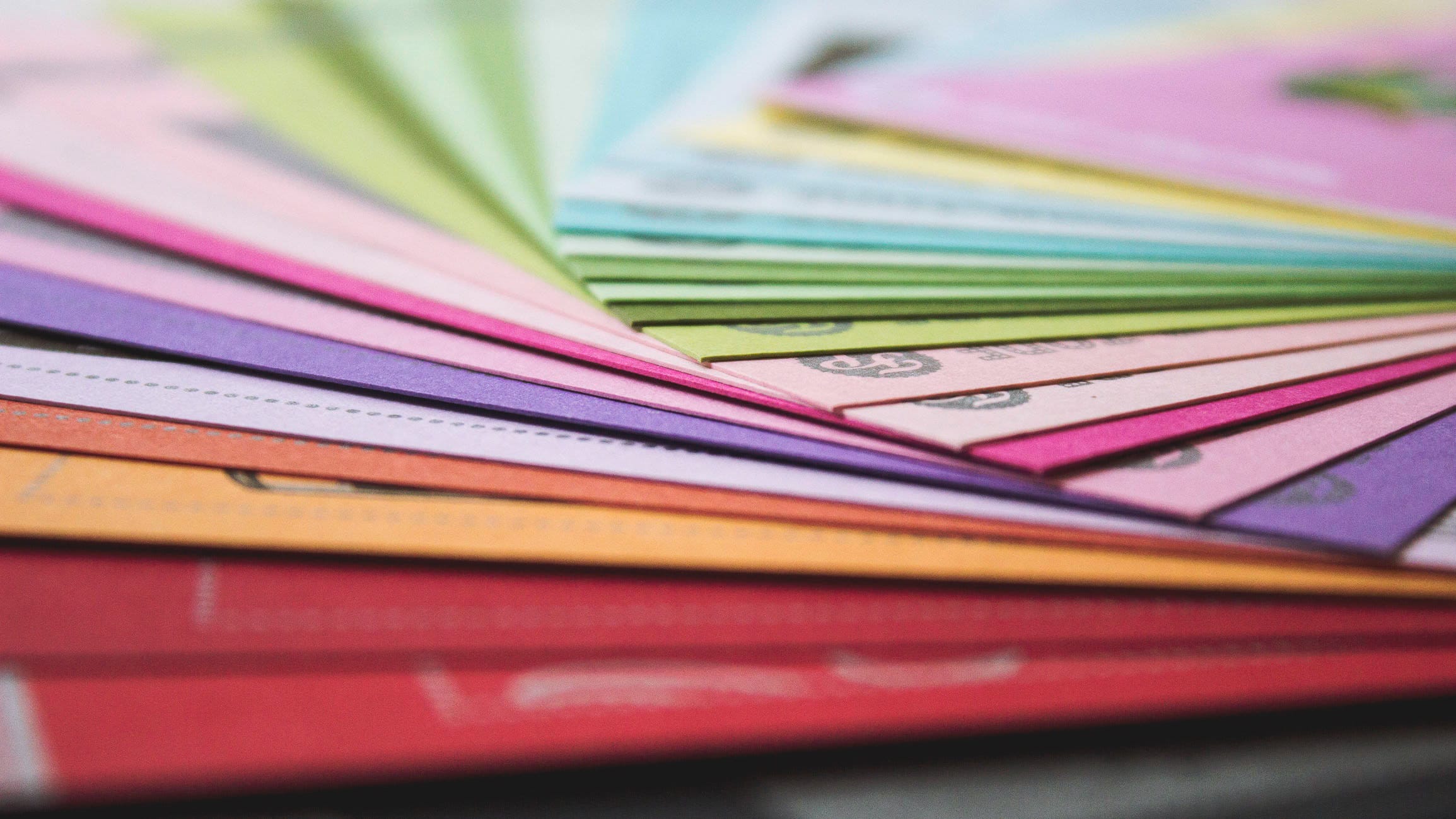 multiple colorful pieces of paper that are coupons for discounted services