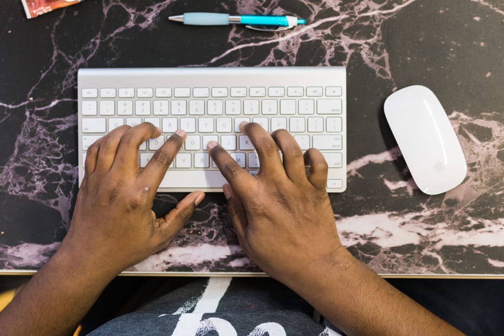 Hands typing on keyboard for effective CTA