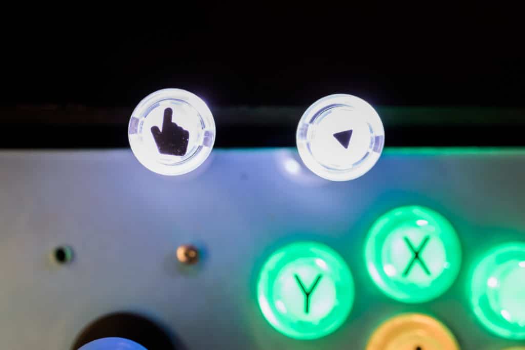 An few colorful buttons depicting shapes and letters