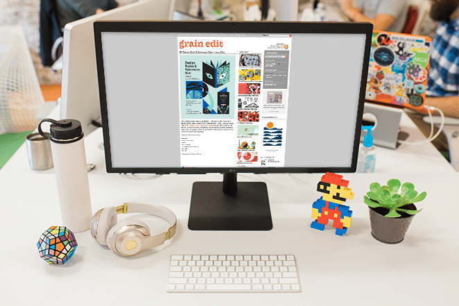 desk scene with grain edit website with large right sidebar on desktop
