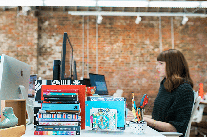 an art director at desk with books on lessons design classes do not teach